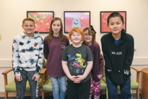 Five kids, who had limb-salvage surgery for bone cancer, pose smiling.