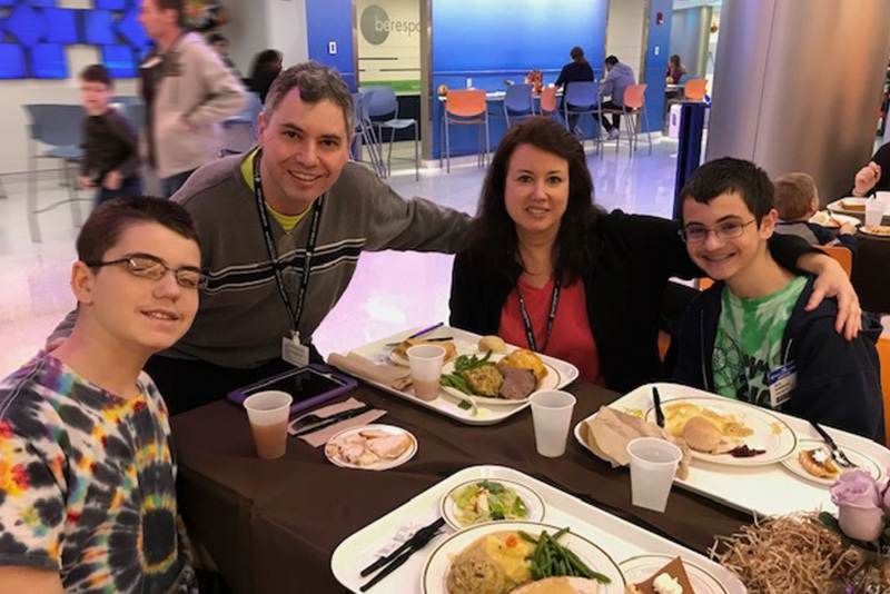 Midaortic syndrome patient Matt eats with his family at Boston Children's