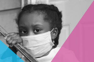 Black girl with a mask on her face during COVID-19.