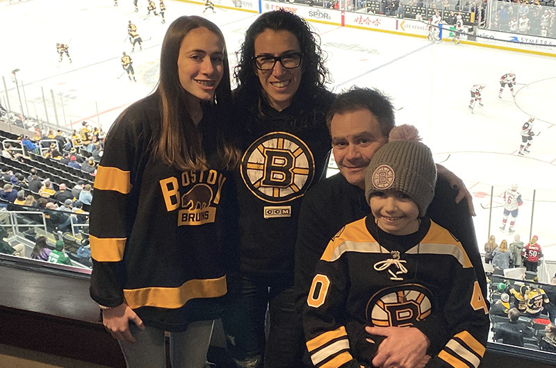 Ava with her family at a February 2020 Bruins game after receiving car t-cell therapy.
