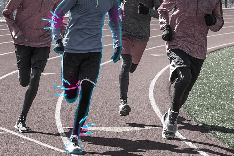 Runners on a track with pain radiating from one runner's ankle and knee.