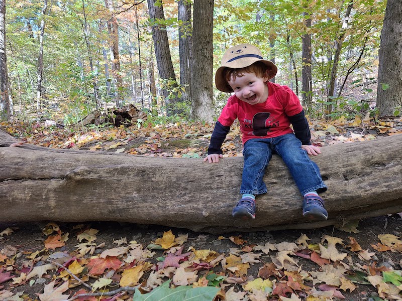 Finn, who was born with clubfoot, outside enjoying a fall day