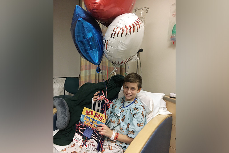 Brendan in a hospital bed at Boston Children's for surgery to remove bladder diverticula and blockages