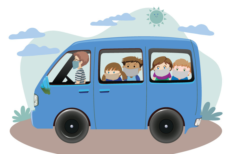 An image of a parent driving a carful of kids. They are all wearing masks.
