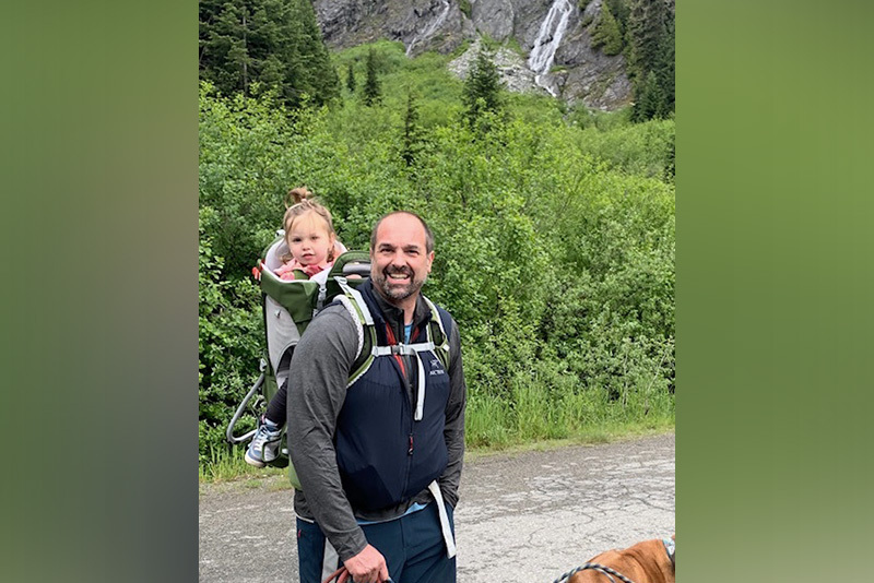hadley and her dad on a hike in the mountains