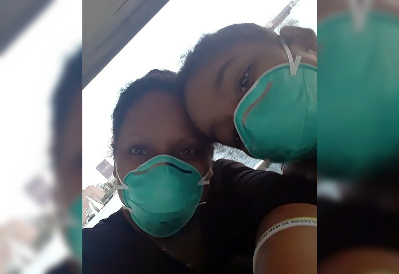 Asada, who has aplastic anemia, with her mother, both wearing face masks  on a trip to Boston. 