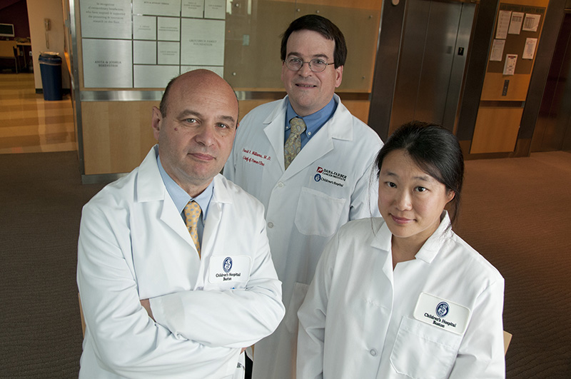 Three doctors from the gene therapy team, David Williams, Luigi Notarangelo and Sun-Yung Pai, pose in the hospital. 