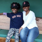 Asada, who had a bone marrow transplant, with her mom, Hadas, sitting together in the Red Sox dugout at Fenway Park