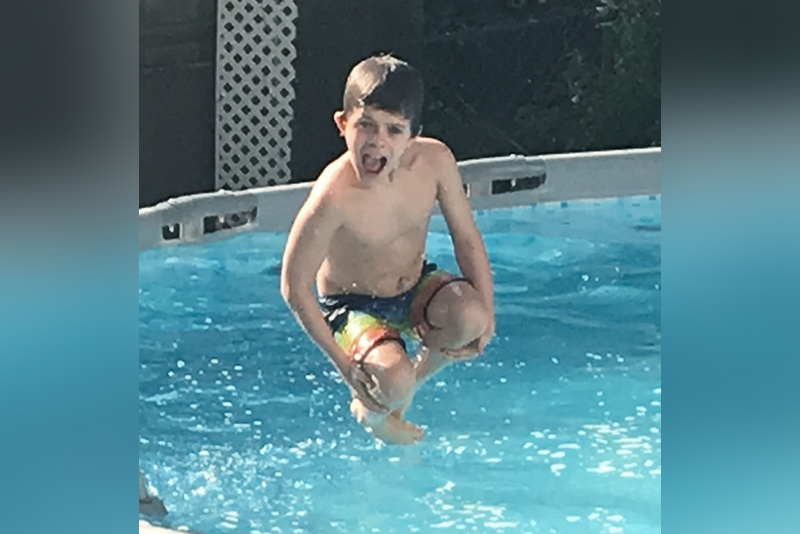 carter, who had an imperforate anus, jumps into a pool
