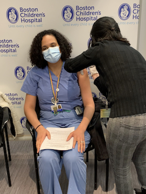 Dr. Polanco Walters receives a COVID-19 vaccine