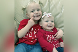 harper and magnolia with their arms around each other. they both were treated for vascular rings