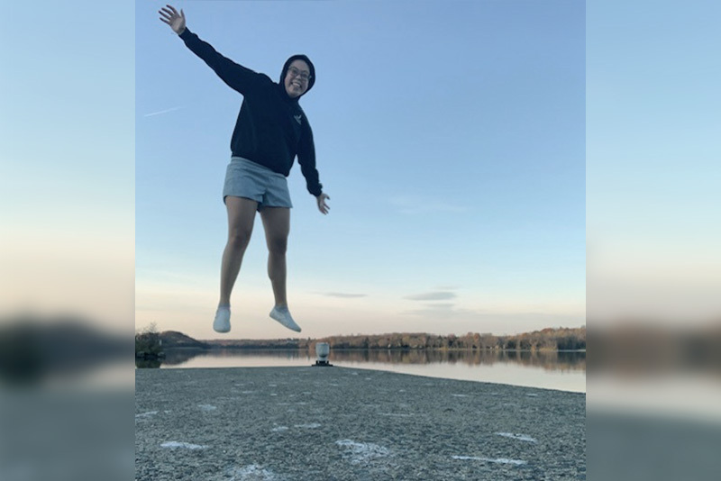 emily, who has graves' disease, jumps for joy.
