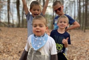 Joshy, who had a kidney transplant, plays outside with his three brothers