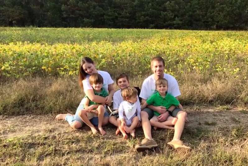 Joshy, who had a kidney transplant, with his family in a field near their home in Virginia. 