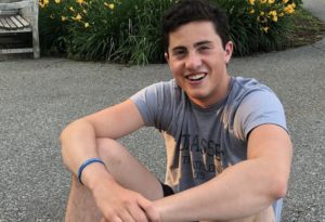 Dylan, who had a TBI, poses at Cornell, where he is studying pre-med