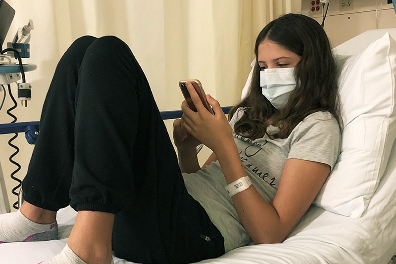 karlijn sits on a hospital bed before surgery for her seizures