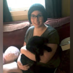 meghan, who had uesl liver cancer, cuddles with her dog