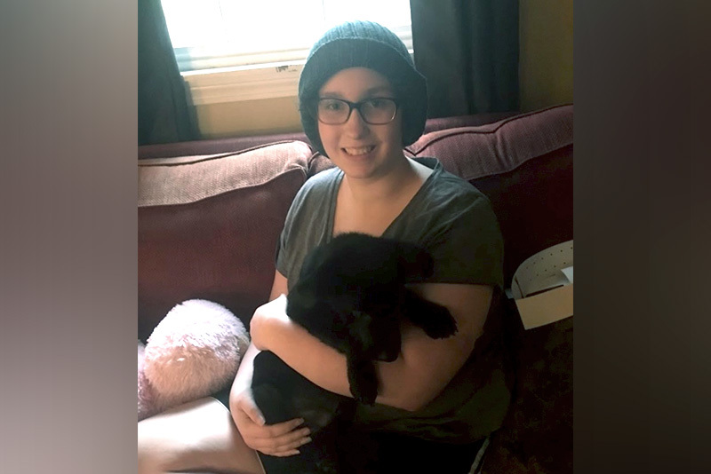 meghan, who had uesl liver cancer, cuddles with her dog