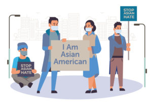 Asian Americans hold signs speaking out against Asian hate in response to anti-Asian racism.