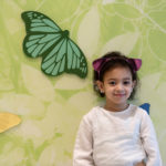 laila, who has After months without answers for Laila, intensive evaluation by a team of Boston Children’s clinicians revealed a rare #genetic condition called #trichohepatoenteric syndrome, poses by a butterfly mural