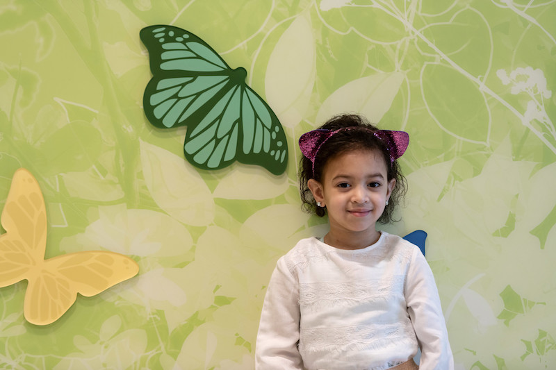 laila, who has After months without answers for Laila, intensive evaluation by a team of Boston Children’s clinicians revealed a rare #genetic condition called #trichohepatoenteric syndrome, poses by a butterfly mural