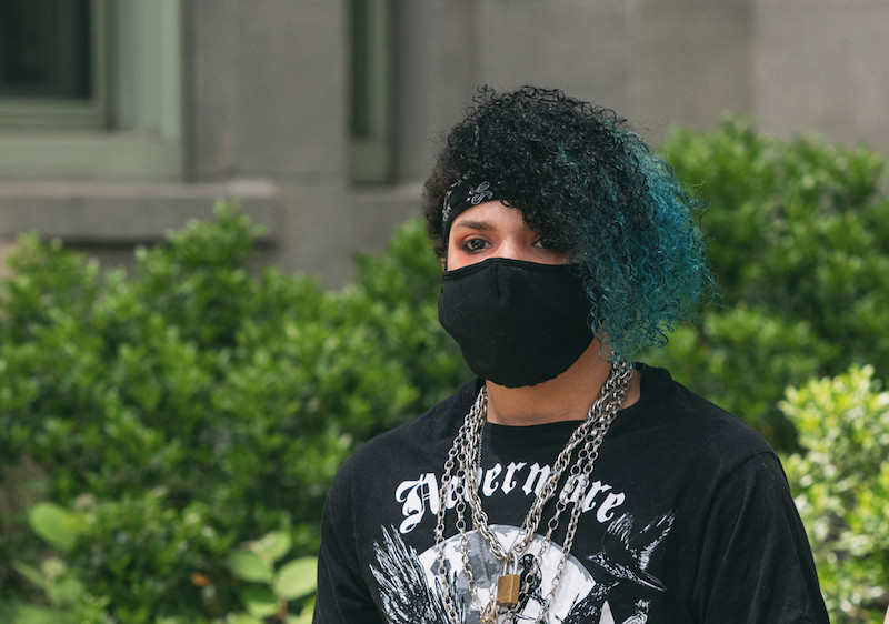 evan, who underwent gender transition, in a mask