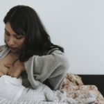 Woman nursing baby