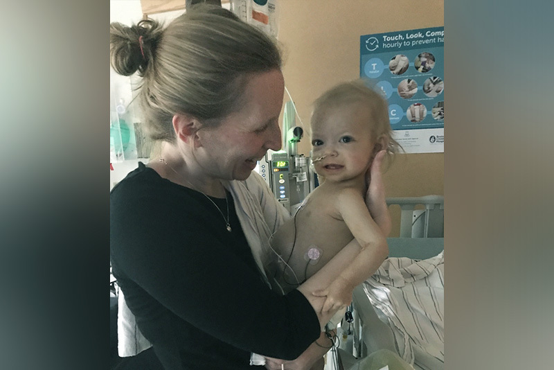 Sarah's mom holds her as a baby. Sarah was diagnosed with biliary atresia.
