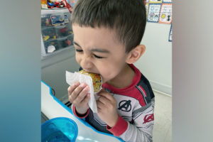 joecel eats a cupcake