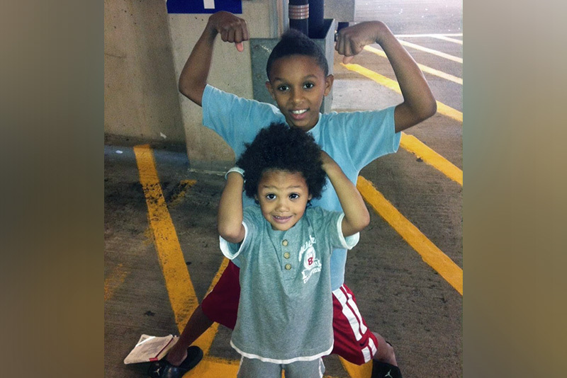 Kobe, who had myocarditis, goofs around with this younger brother