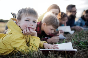 a photo of a group of childhood friends reading together