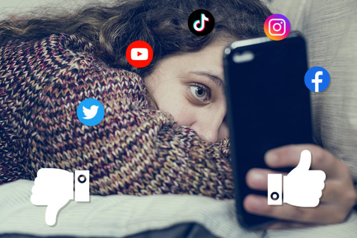 Teen with possible anxiety or depression looking at phone with social media swirling around her head.