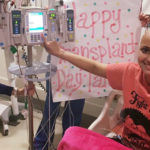 A cheerful Tara Daniels in her hospital bed, starting her stem cell transplant.