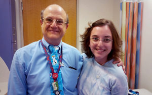 andrea and dr sam nurko smile at the camera