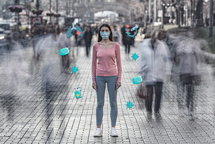 A teen girl standing in the street with COVID-10 related symbols around her (masks, viruses, etc.)