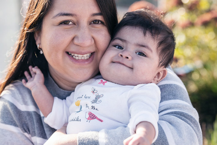 Isabel holds her infant daughter Marcela in the rooftop garden at Boston Children's Hospital.
