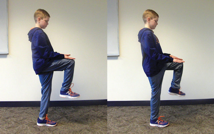 A young boy demonstrates a high knee exercise while standing, in two images.