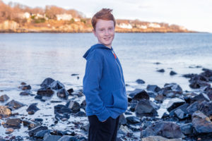 thomas stands on the beach, feeling better after getting help for ARFID