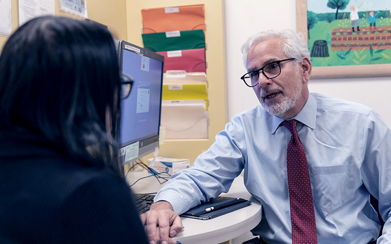 Dr. Richard Goldstein in consultation with a parent