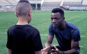 A father talks to his son after a bad day in sports.