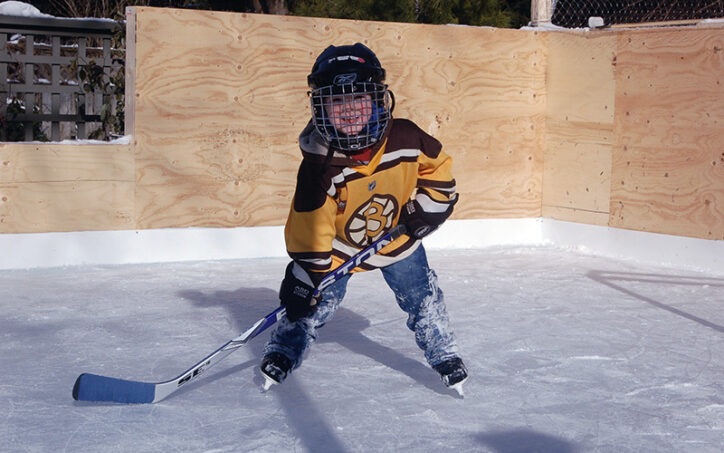 Grady, who later had osteochondritis dissecans, at age 4 playing hockey in a backyard rink in a Boston Bruins jersey.