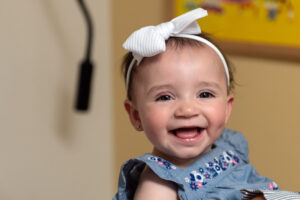 mila smiles at the camera