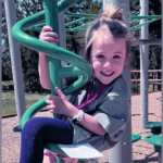 drew plays on a jungle gym