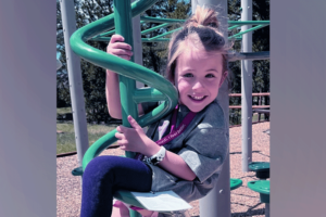 drew plays on a jungle gym