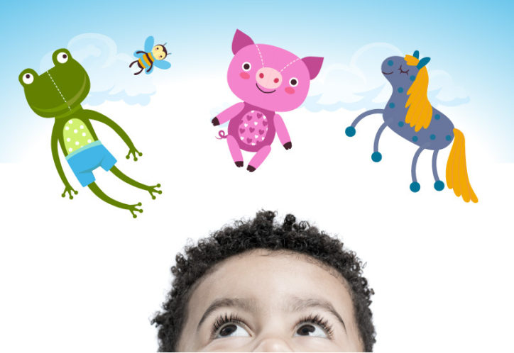 A young boy gazes above his head to see a cartoon frog, bumble bee, pig, and unicorn.