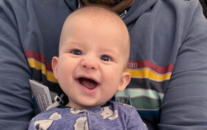 Myles as a baby, smiling at the camera