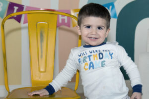 walter smiles while wearing a shirt that says "will wake for birthday cake"