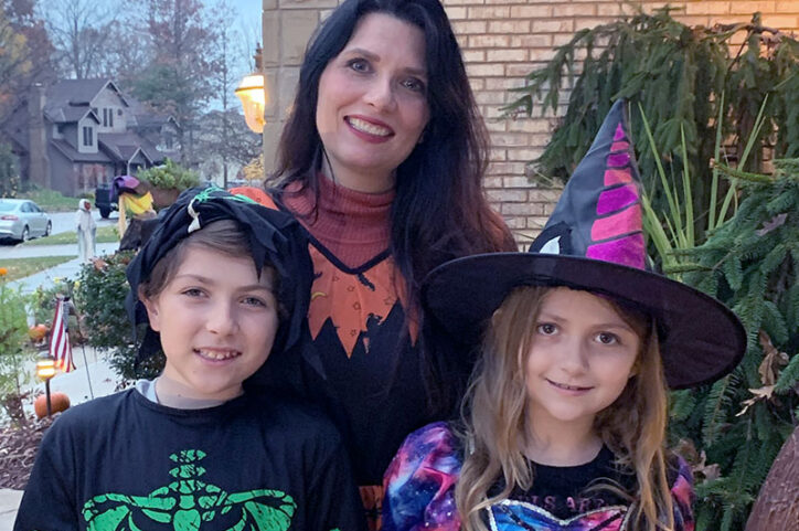 Louis and Livia, with their mother, Adrienne, enjoy trick-or-treating.
