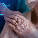 An elderly woman presumably with dementia, holding the hand of a caregiver, with tau molecules added.