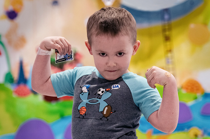 Conner, the first CCALD patient to receive Skysona outside a clinical trial, flexes his muscles.